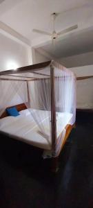 Postel nebo postele na pokoji v ubytování Golden Lodge Tangalle