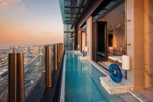 a swimming pool on the edge of a building with a view at One&Only One Za'abeel in Dubai