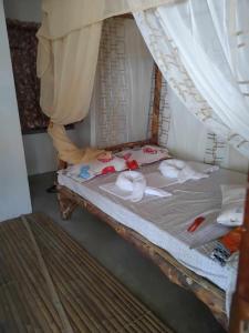 Ένα ή περισσότερα κρεβάτια σε δωμάτιο στο Reyana Beach House