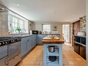 a kitchen with a island in the middle of it at 4 Bed in Isle of Purbeck IC101 in Corfe Castle