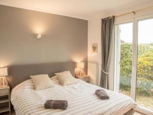 Postel nebo postele na pokoji v ubytování La Roque