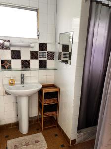 a bathroom with a sink and a shower at Cheerful 3 bedroom home with stunning views in Quartier la Fleury Guiné