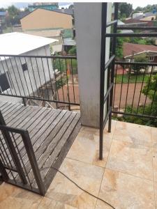a balcony with a bench and a railing at Residencial GM in San Vicente