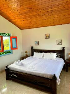Voodi või voodid majutusasutuse Hotel Karlaká Calarcá Quindio - Eje Cafetero toas