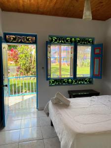 Voodi või voodid majutusasutuse Hotel Karlaká Calarcá Quindio - Eje Cafetero toas