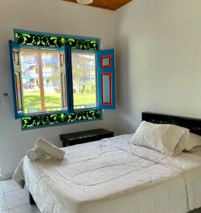 Voodi või voodid majutusasutuse Hotel Karlaká Calarcá Quindio - Eje Cafetero toas