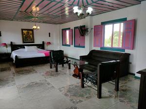 Voodi või voodid majutusasutuse Hotel Karlaká Calarcá Quindio - Eje Cafetero toas