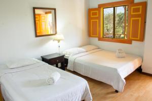 Voodi või voodid majutusasutuse Hotel Karlaká Calarcá Quindio - Eje Cafetero toas