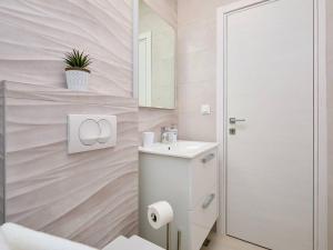 a white bathroom with a sink and a mirror at Apartments by the sea Okuklje, Mljet - 22341 in Okuklje +15 photos