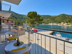 a balcony with a view of a body of water at Apartments by the sea Okuklje, Mljet - 22341 in Okuklje