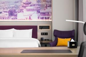 Voodi või voodid majutusasutuse Hampton by Hilton Foshan Shunde Beijiao toas
