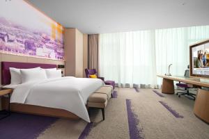 Voodi või voodid majutusasutuse Hampton by Hilton Foshan Shunde Beijiao toas