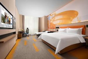 Voodi või voodid majutusasutuse Hampton by Hilton Foshan Shunde Beijiao toas