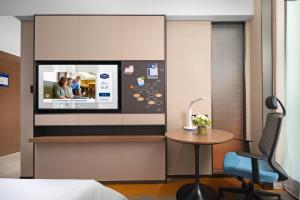Televiisor ja/või meelelahutuskeskus majutusasutuses Hampton by Hilton Foshan Shunde Beijiao