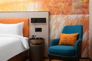 Voodi või voodid majutusasutuse Hampton by Hilton Foshan Shunde Beijiao toas