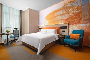 Voodi või voodid majutusasutuse Hampton by Hilton Foshan Shunde Beijiao toas