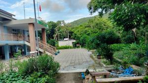 a building with a courtyard in front of it at DAT THAM Beach - Con Dao National Park in Con Dao
