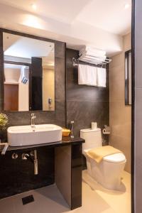 a bathroom with a sink and a toilet at Kailash Boutique Hotel in Kathmandu