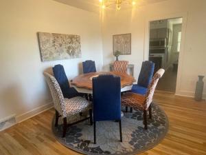 a dining room with a wooden table and chairs at Bogus Property in Salt Lake City