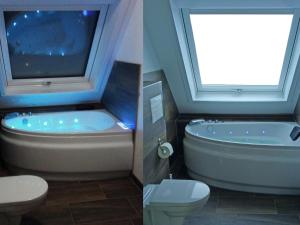 a bathroom with a tub and a toilet and a window at Ferienhaus in Neukirchen nahe Sylt Strand in Neukirchen +31 photos
