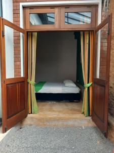 a bedroom with a bed inside of a door at Cosy Secure Comfortable for whole family in Colombo