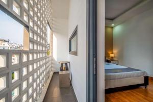 Postel nebo postele na pokoji v ubytování Richy Dalat Hotel