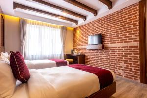 Letto o letti in una camera di Kailash Boutique Hotel