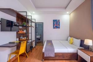Postel nebo postele na pokoji v ubytování Richy Dalat Hotel