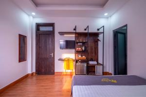 Postel nebo postele na pokoji v ubytování Richy Dalat Hotel