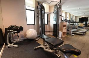 a gym with several exercise bikes in a room at Cosmo Hotel Kuala Lumpur in Kuala Lumpur