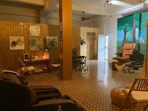 a living room with chairs and a waiting room at Spa Apartment in Mayaguez