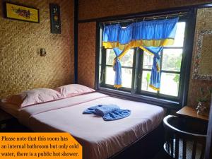 Letto o letti in una camera di Yoschi's Hotel Bromo