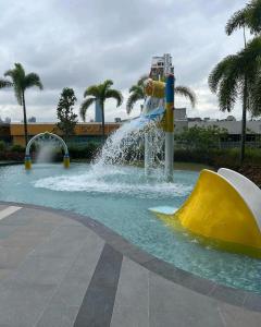 a water park with a slide in the water at Trion KL Sweet Grace X TRX Sky Tower in Kuala Lumpur