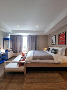Llit o llits en una habitació de LAZYDAY IN NIMMAN