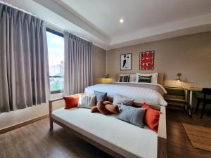 Llit o llits en una habitació de LAZYDAY IN NIMMAN