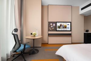 Voodi või voodid majutusasutuse Hampton by Hilton Foshan Shunde Beijiao toas