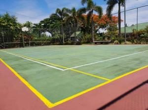 a tennis court with a tennis court at LE RIC HOUSING LTD in Apia
