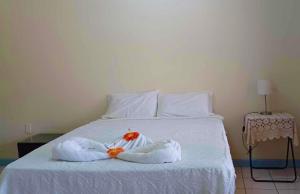 Un pat sau paturi într-o cameră la LE RIC HOUSING LTD