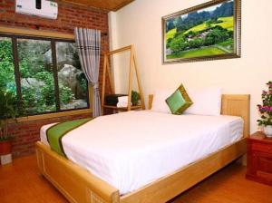 Giường trong phòng chung tại Tam Coc Valley Homestay