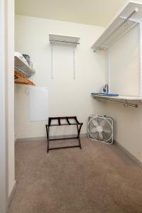 a room with a table and a fan in it at Stunning Nulu 1BR CozySuites 05 in Louisville +27 photos
