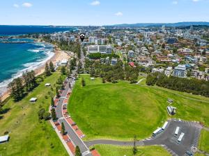 an aerial view of a beach and the ocean at Ocean Vista Escape - A Lofty Beachfront Penthouse in Wollongong