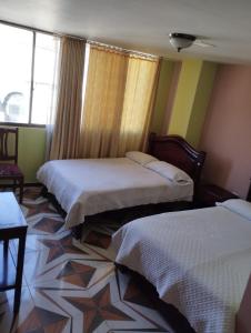 Cama o camas de una habitación en Hotel Torre Bolívar
