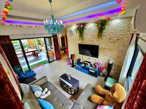 an overhead view of a living room with a couch at Arawan Pool Villa Hua Hin in Hua Hin