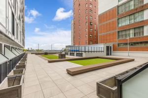 a courtyard in a building with two tall buildings at Zodiak Stays Cozy CBD 2BR Near Top Dining Spots in Auckland