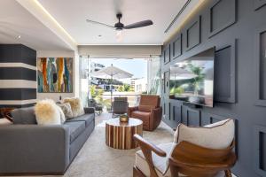 a living room with a couch and a table at BEST Views of PV-Banderas Bay from Rooftop Infinity Pool in Puerto Vallarta