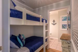 a bunk bed with blue pillows in a room at Destin West Gulfside 209 - You Own Slice of Paradise! - Ocean Views - Free Beach Service! in Fort Walton Beach +33 photos
