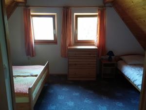 Postel nebo postele na pokoji v ubytování Apartma Brin Bovec