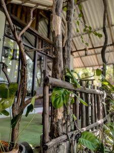 a wooden fence around a tree in a building at Secret Mountain Paradise in Ella