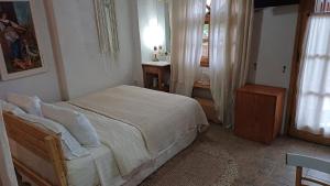 Postel nebo postele na pokoji v ubytování Harmonic Place Loutraki