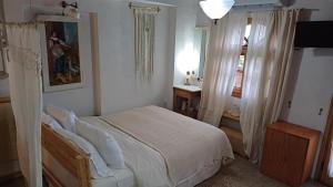 Postel nebo postele na pokoji v ubytování Harmonic Place Loutraki